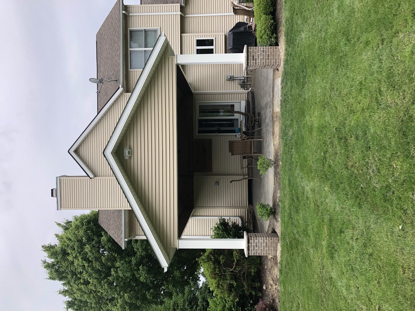 Covered porch addition with stone piers