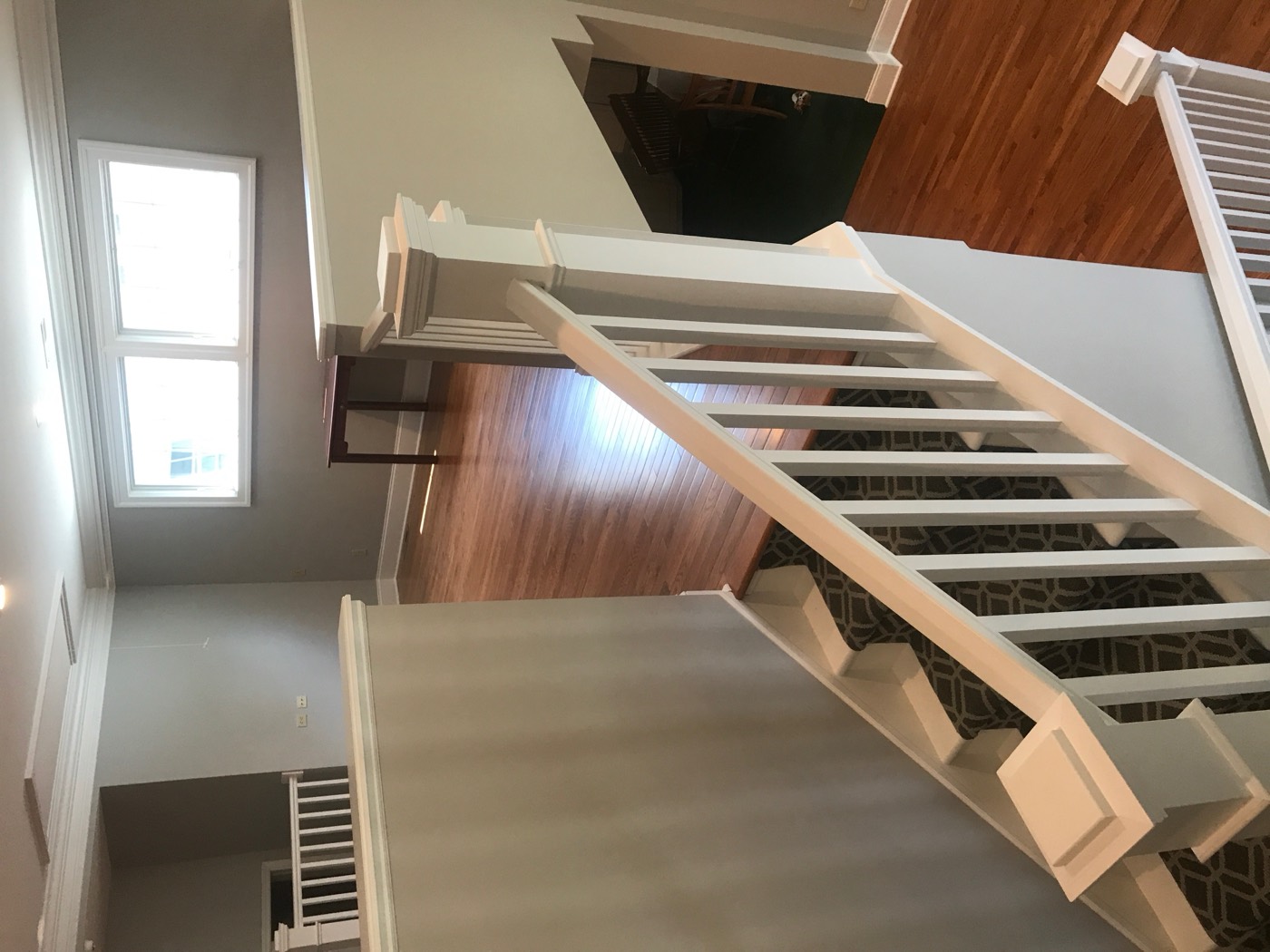 Custom staircase and hardwood